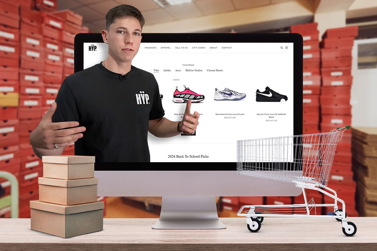 How to Open a Shoe Store 7 Business owner standing in front of a monitor showing the HYP Miami website