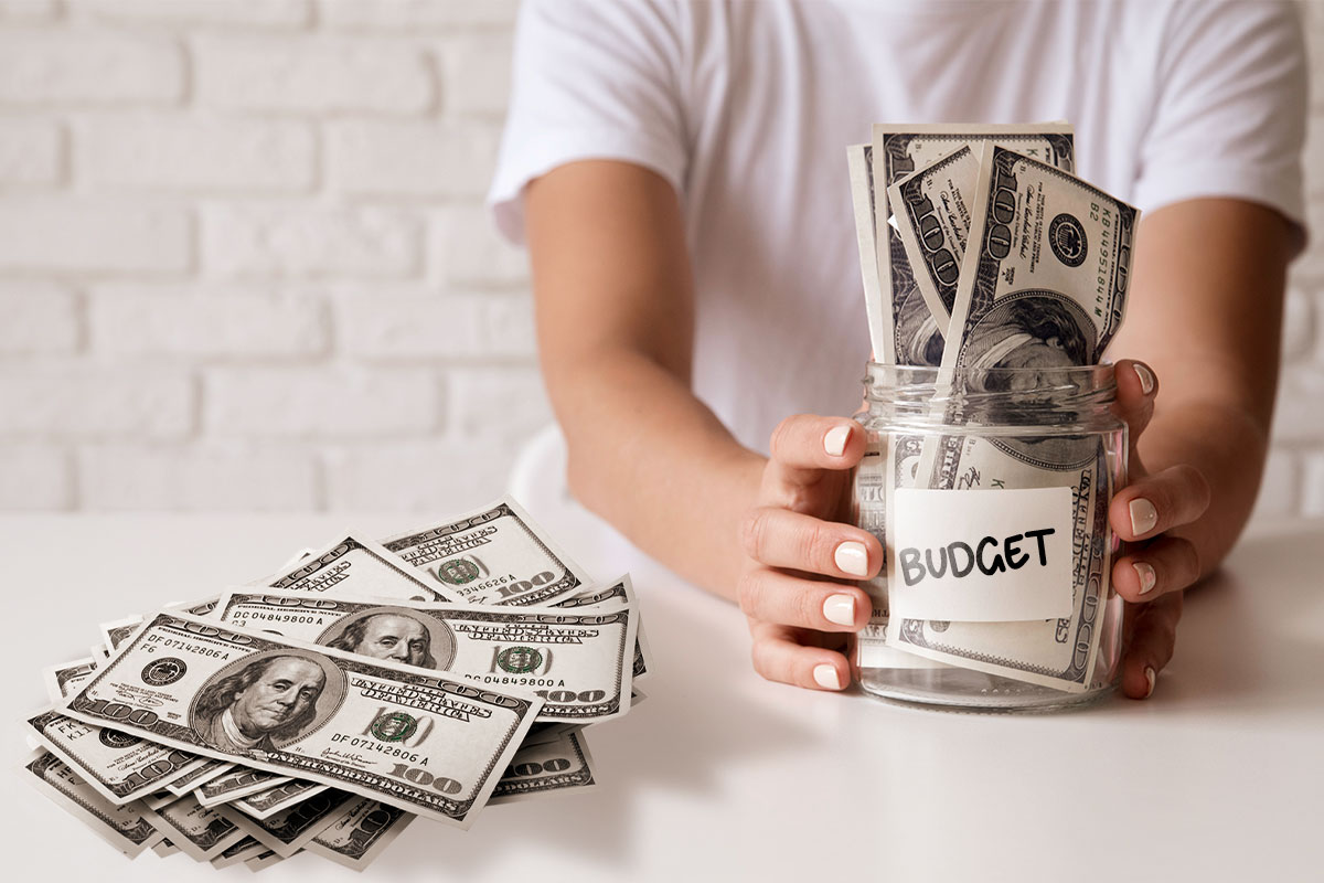 How to Work for Myself 10 Hundred-dollar bills stuffed in a jar that says "budget"