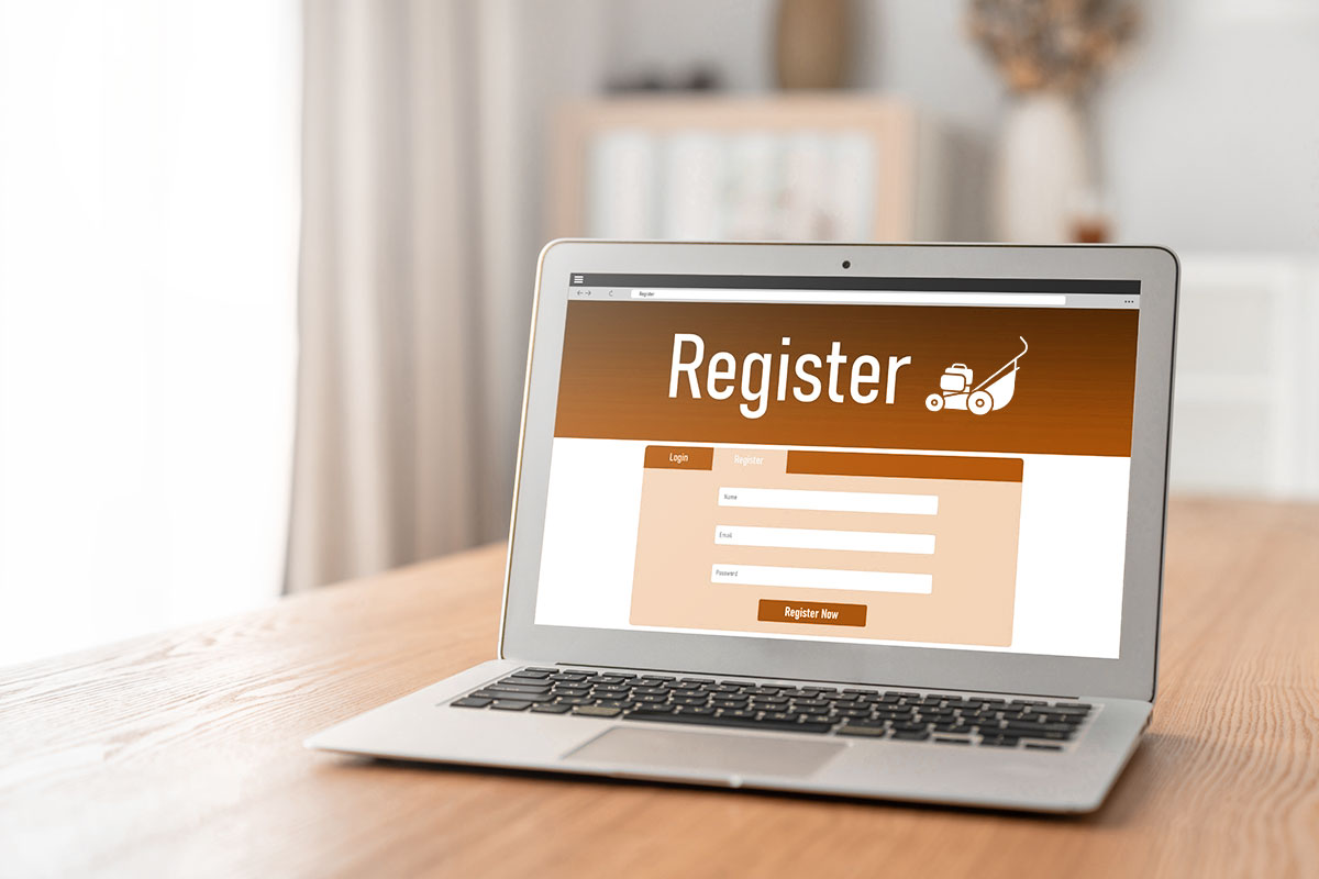 Laptop on table with a registration screen