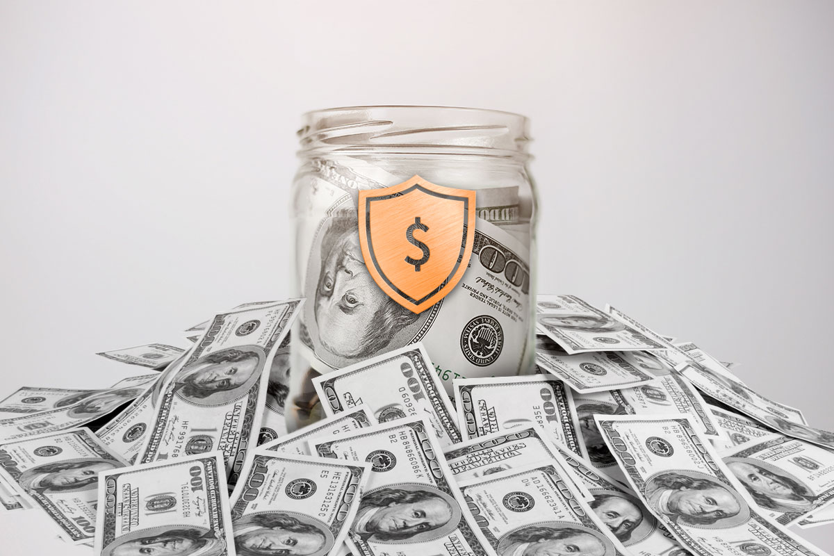 Best Laundromat Franchises of 2025 12 A jar full of money surrounded by loose hundred-dollar bills