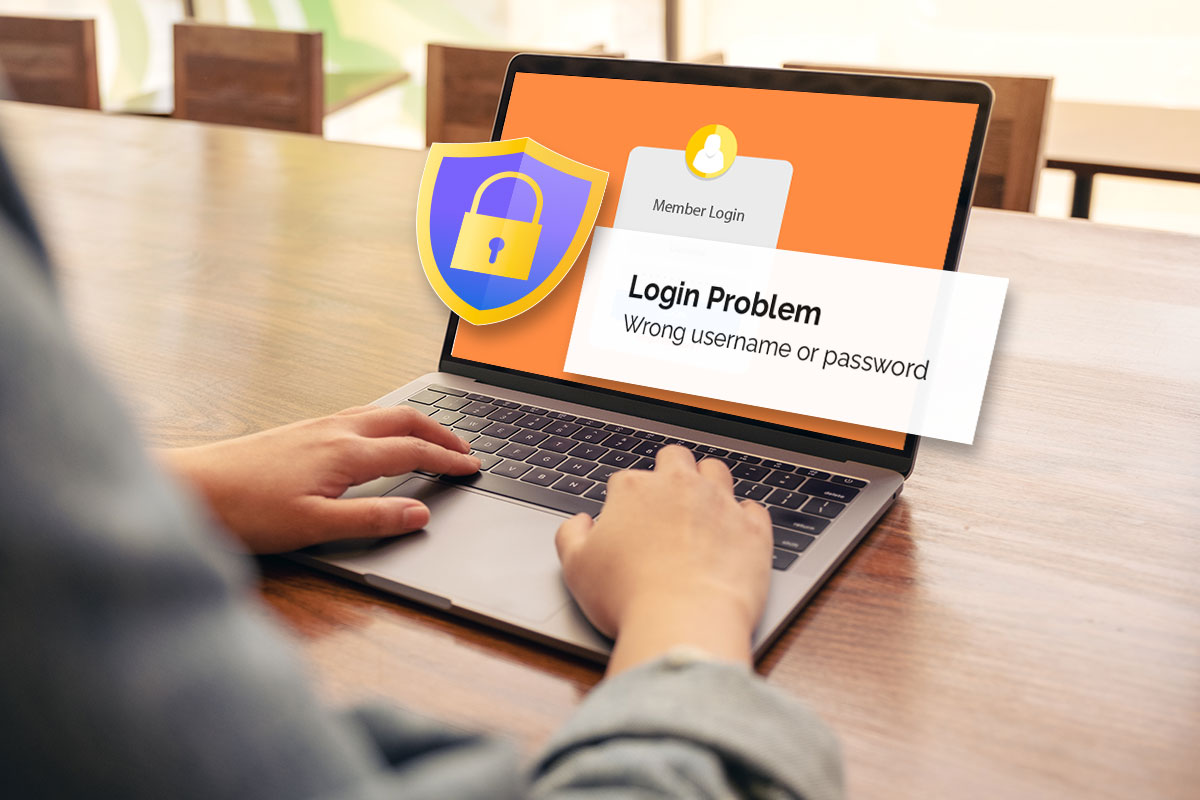 A laptop displaying a login problem and a security lock symbol