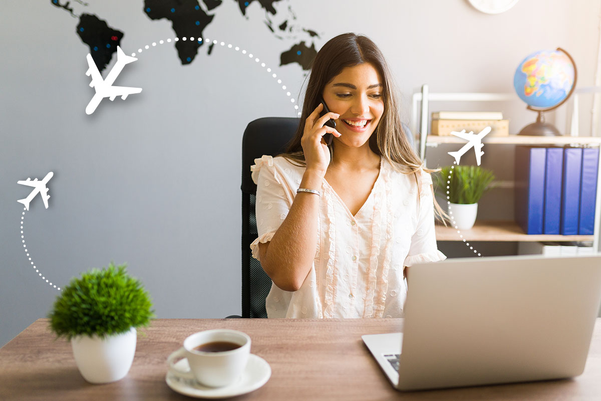 Travel business owner in a home office talking on the phone with cartoon airplanes flying in the background