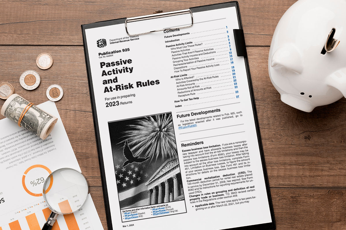 IRS passive activity form on a clipboard