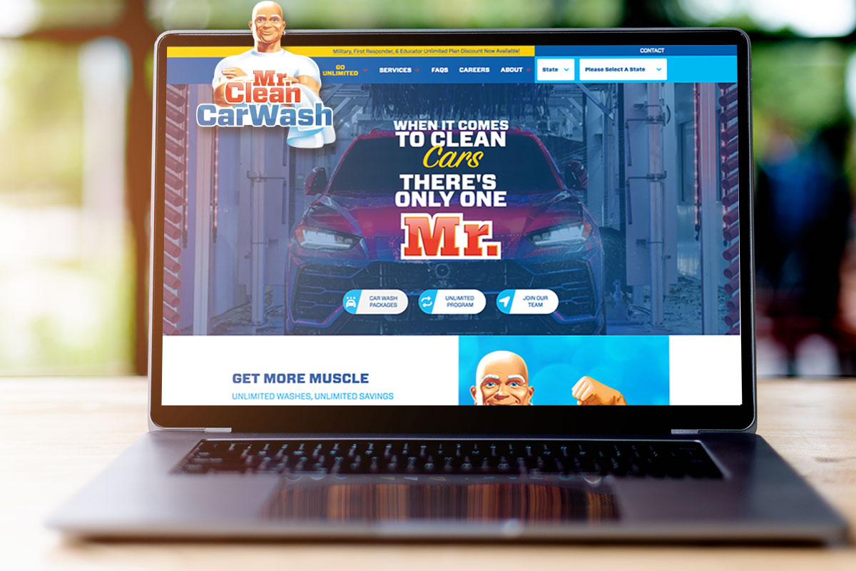 Laptop open to the Mr. Clean Car Wash site