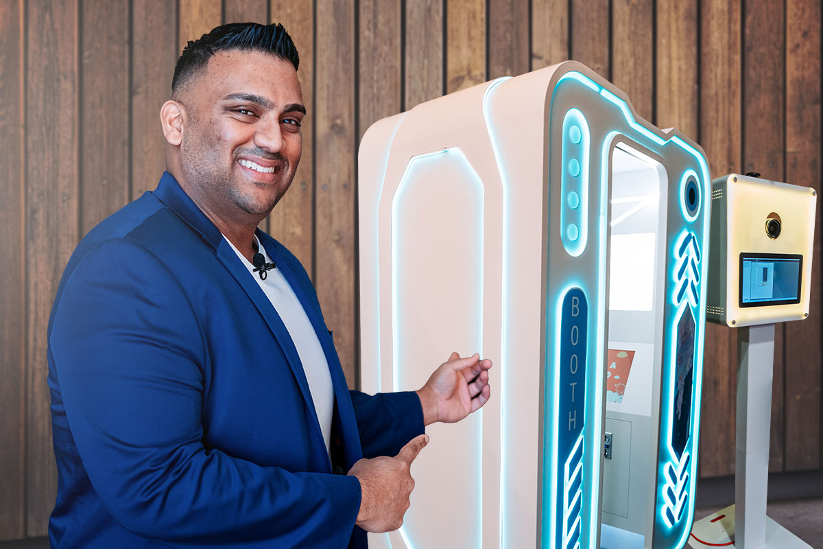 Business owner pointing to a photo booth