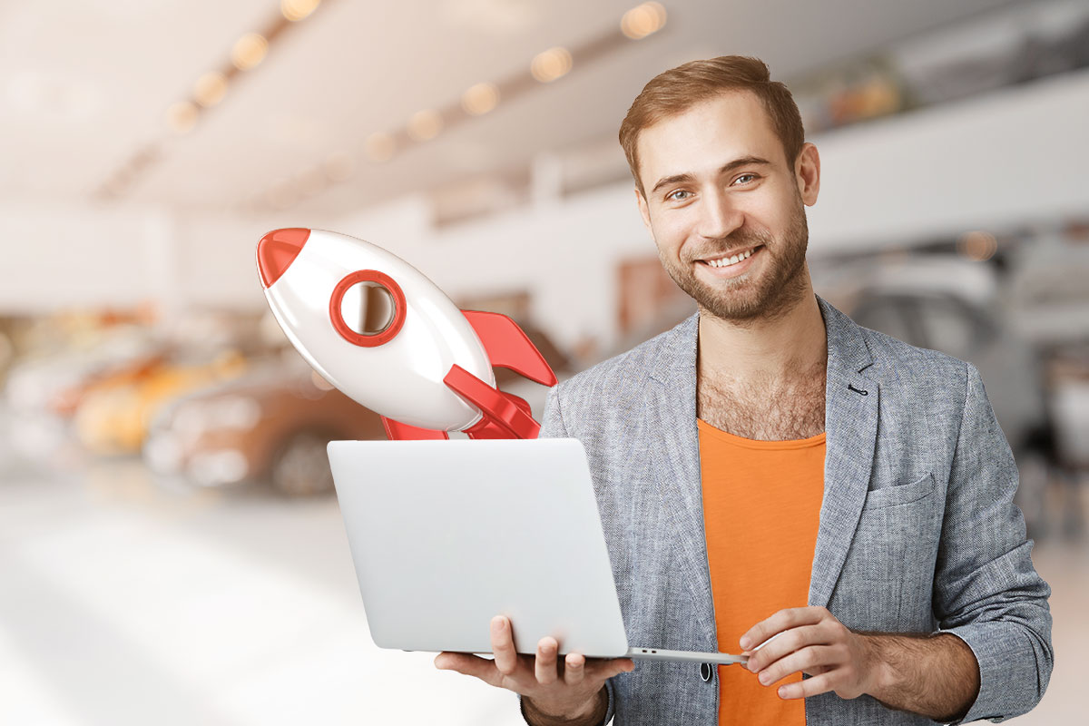 Rental car business owner holding a laptop with a cartoon rocket ship taking off in the background