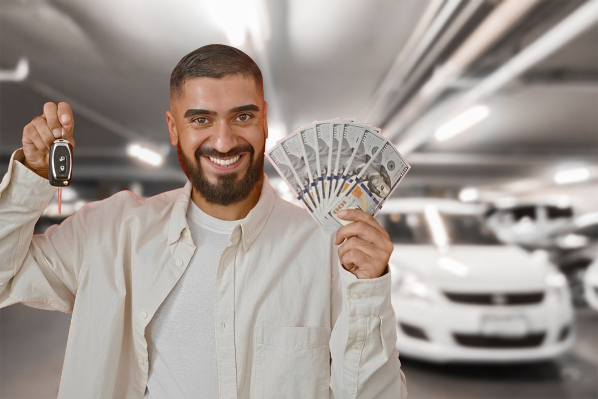 Rental car business owner holding cash and car keys