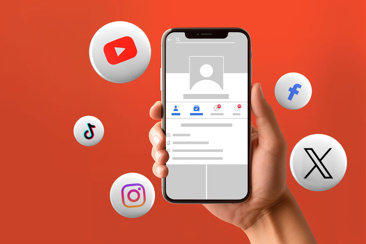 Mobile phone open to a social media page surrounded by social media logos