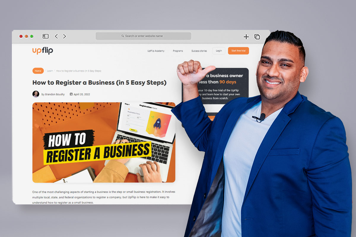 Business owner pointing at a computer screen showing UpFlip's business registration guide