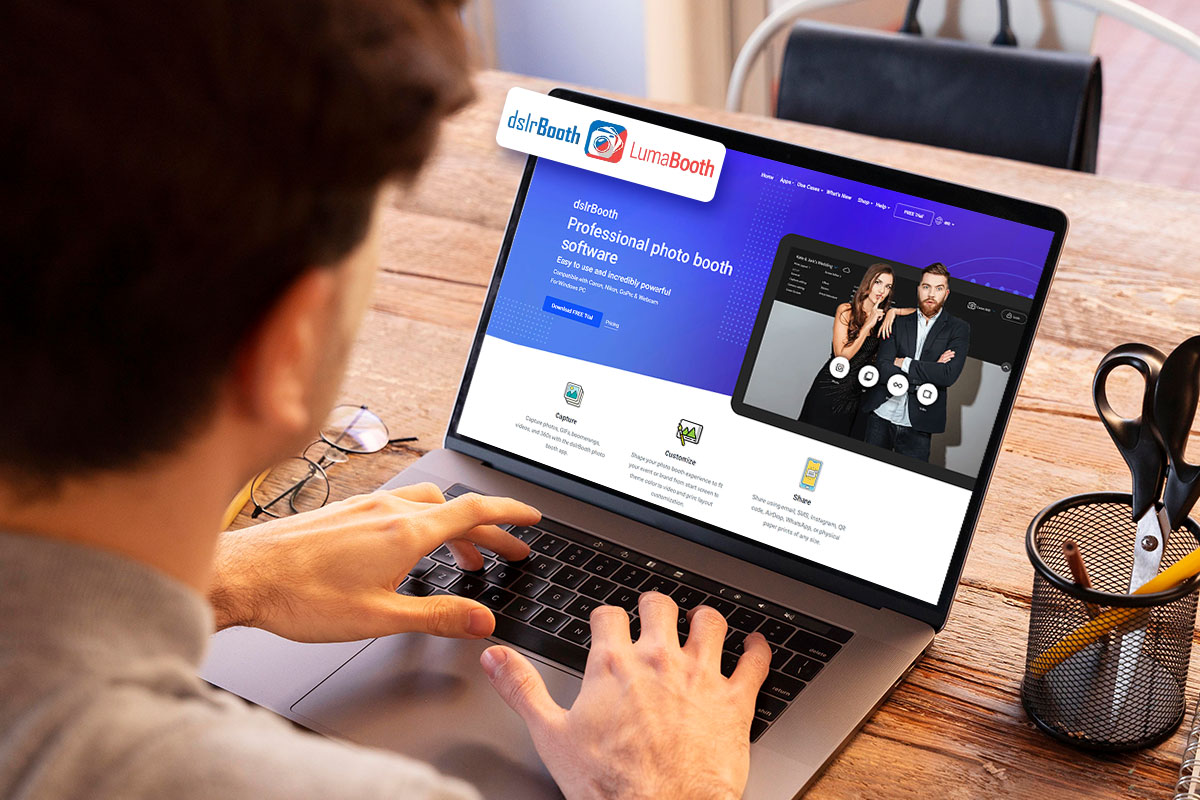 Person on a laptop looking at the dslrBooth software website