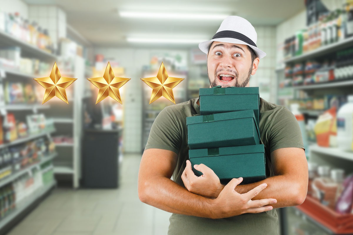 Man holding a stack of purchases next to three gold stars representing a positive customer review
