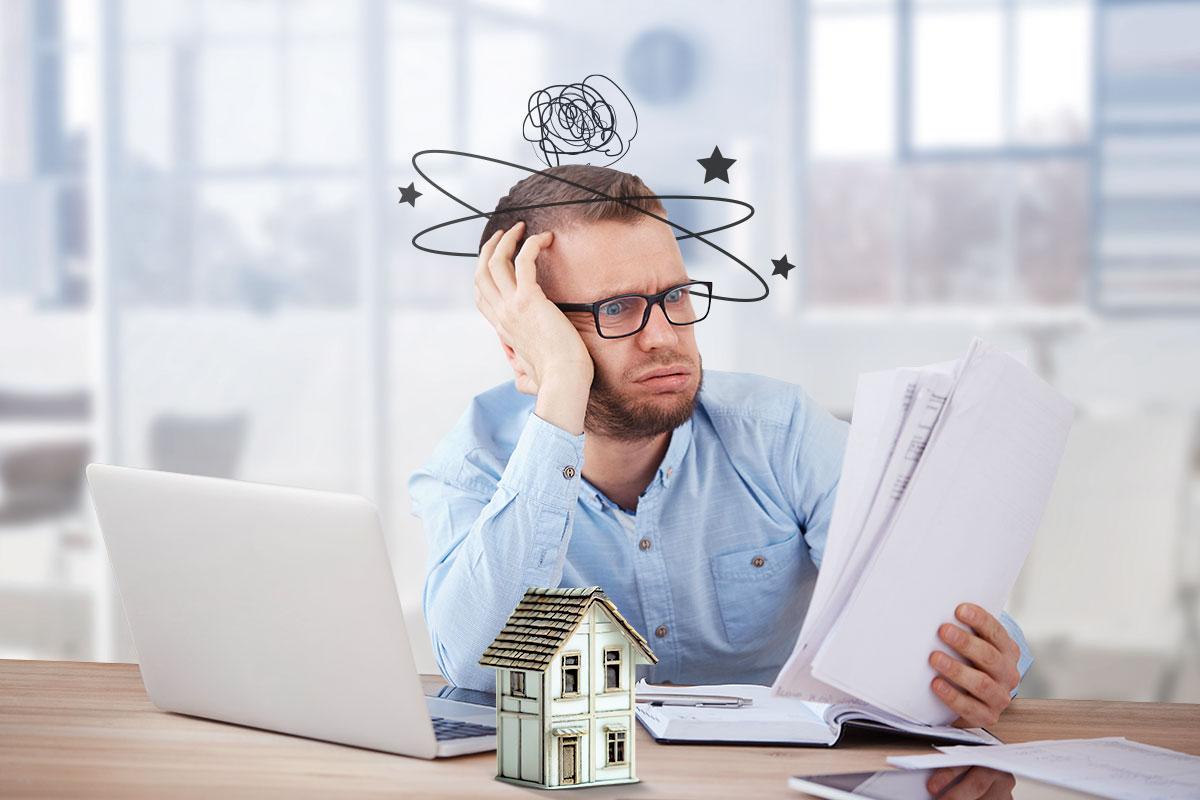 How to Start a $1.5M/Year Business From Home (in 9 Steps) 1 A business owner looking at paperwork with stars floating around his head to show confusion.