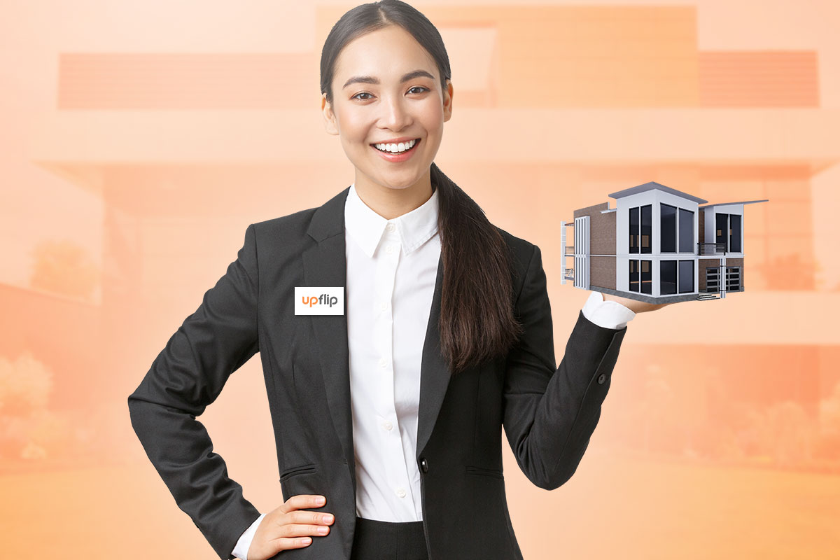 How to Start a $1.5M/Year Business From Home (in 9 Steps) 3 A businesswoman in a suit holding a model of a modern home.