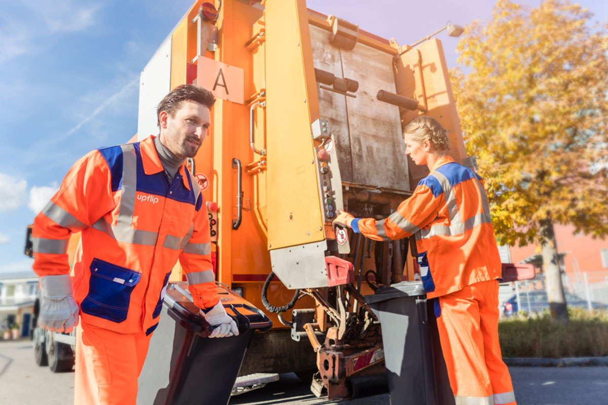 How to Start a $2.5M/Year Junk Removal Business 9 A junk removal crew removing trash bins from a work site and preparing to empty them into a trash truck.