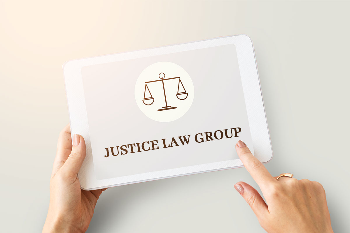 337 Law Firm Names 9 A person using a tablet with the Justice Law Group name and logo.