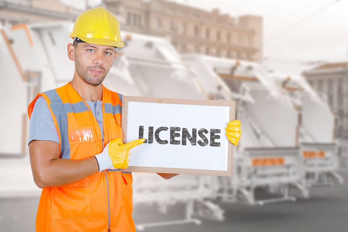 How to Start a $2.5M/Year Junk Removal Business 7 A junk removal business owner holding a sign that says license with a fleet of garbage trucks in the background.