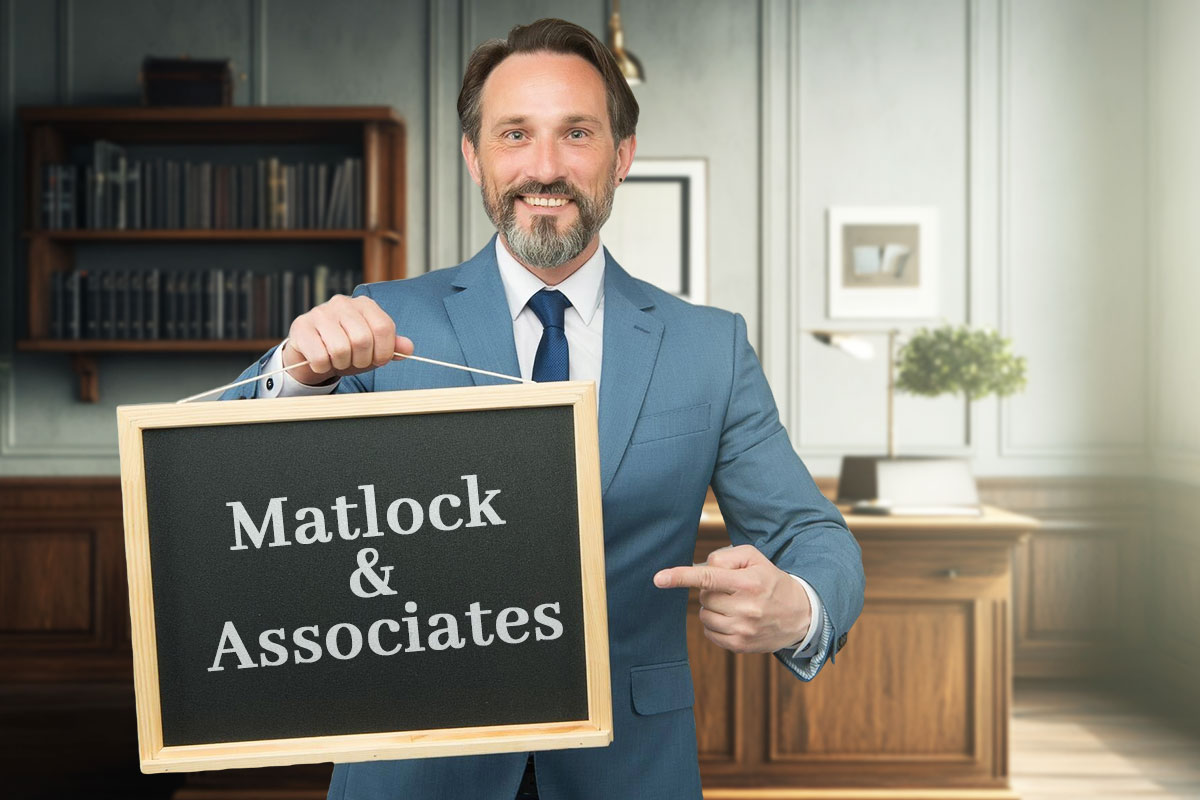 337 Law Firm Names 5 A lawyer holding a sign that says Matlock and Associates.