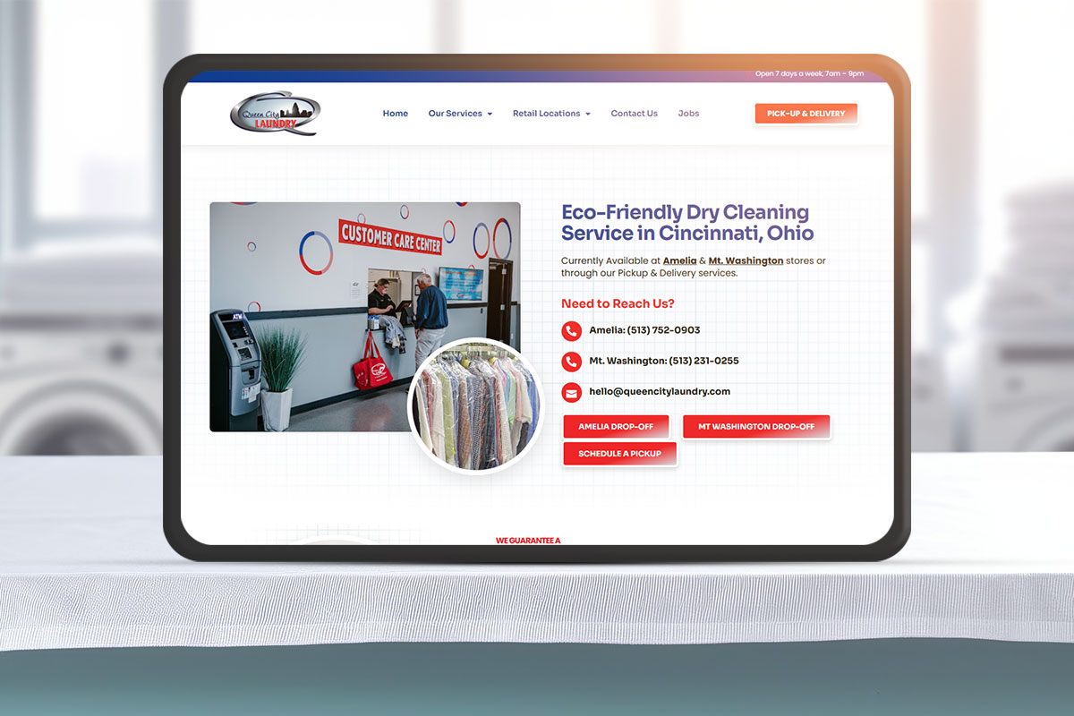 A tablet showing the website for Queen City Laundry's eco-friendly dry cleaning service
