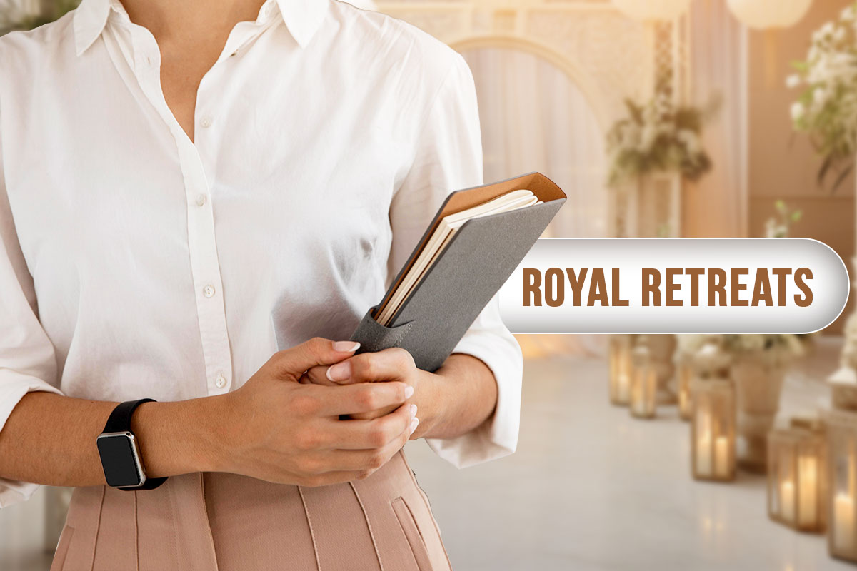 An event planner holding a folder while standing in a venue while a bubble with the business name Royal Retreats floats nearby.