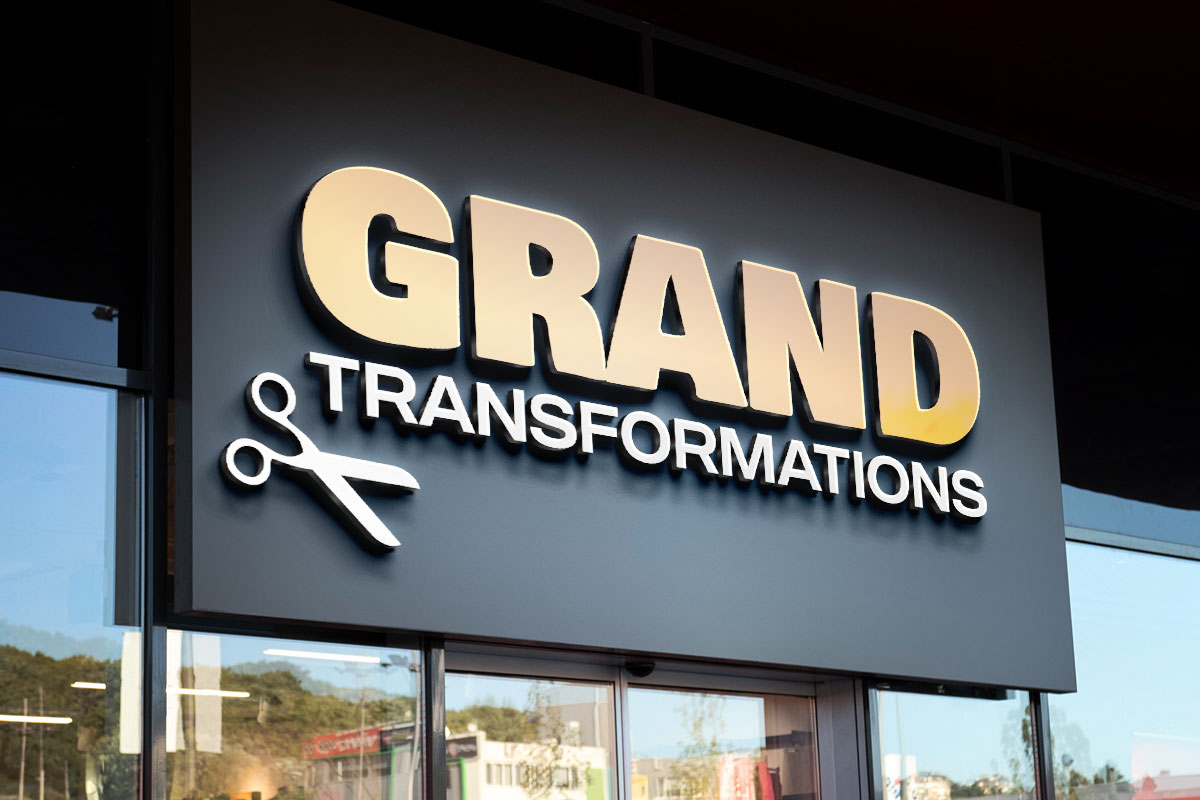 Exterior view of a barbershop with a sign that says Grand Transformations.