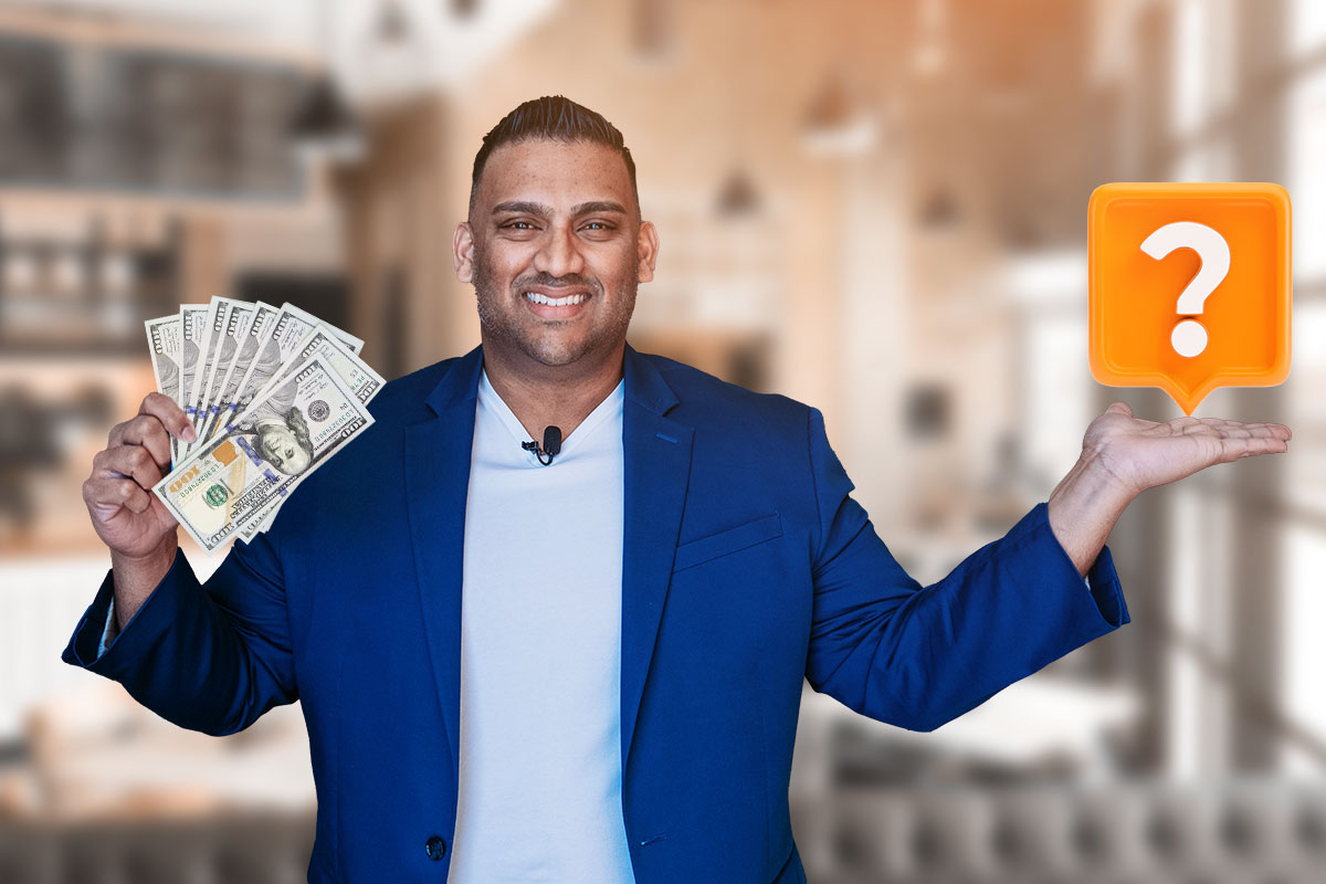 The owner of Photo Booth International with a fan of cash in one hand and a question mark hovering above his other hand.