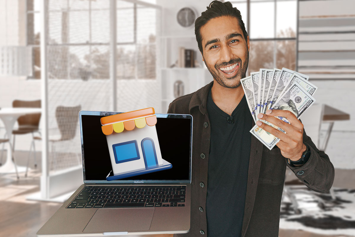 A franchisor holding a fan of cash in one hand and a laptop in the other.