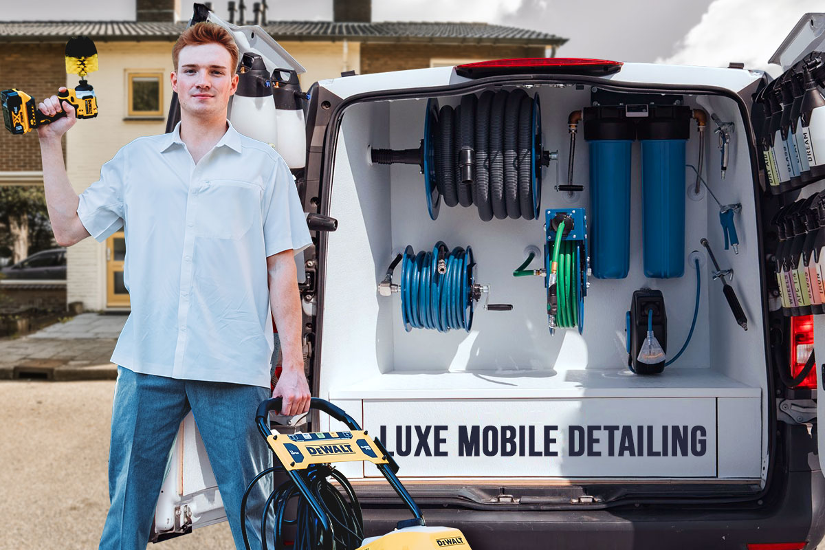 A car detailing professional standing outside of a van full of hoses and equipment with the name Luxe Mobile Detailing across the bottom.