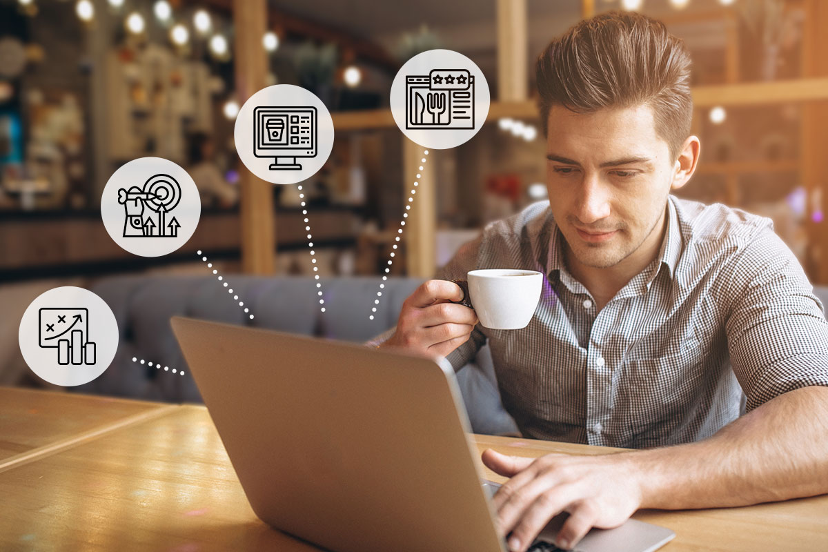 Restaurant Marketing Guide: Best Practices and Ideas for 2025 7 A business owner working on a laptop in a cafe while marketing logos float nearby.