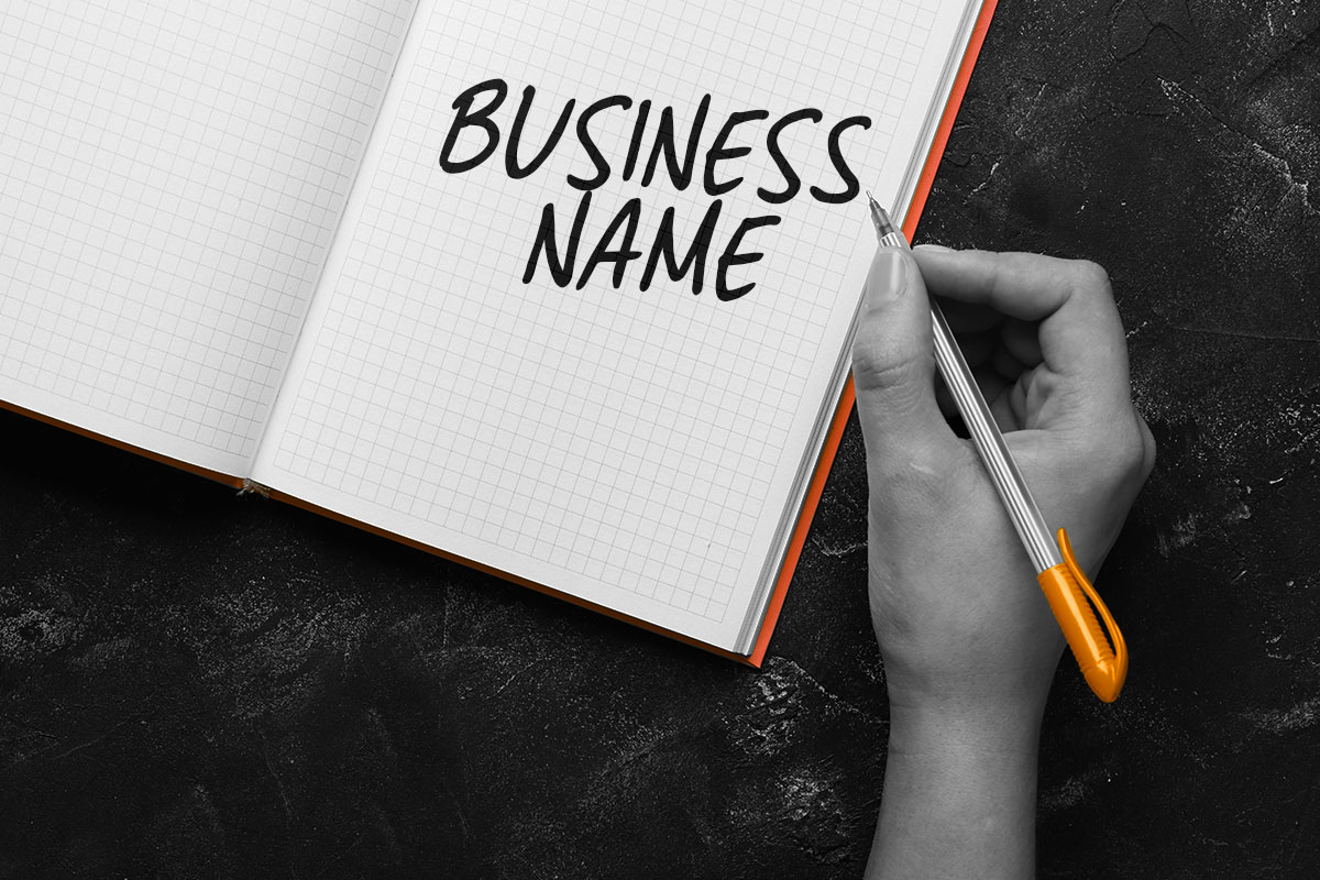 247 Eye-Catching Landscaping Business Names 7 The words business name written in an open notebook.