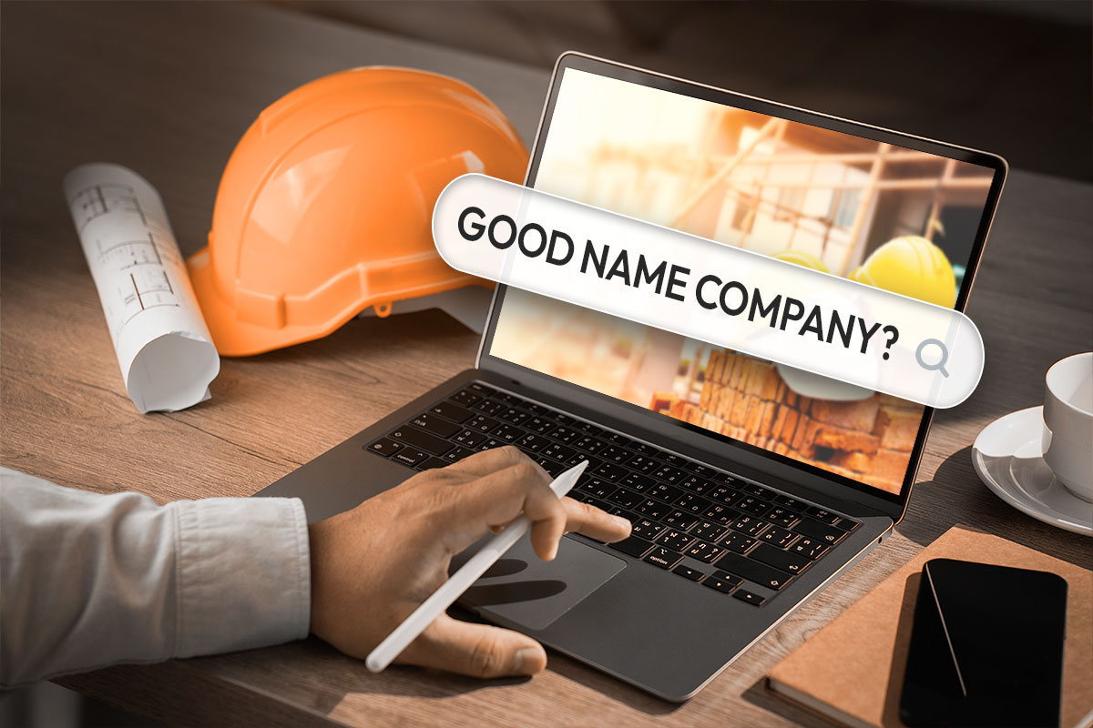 306 Best Construction Company Names 1 A construction company owner searching for good company names on a laptop.