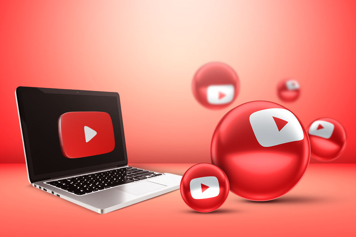 Five red balls with the YouTube logo floating next to a laptop.