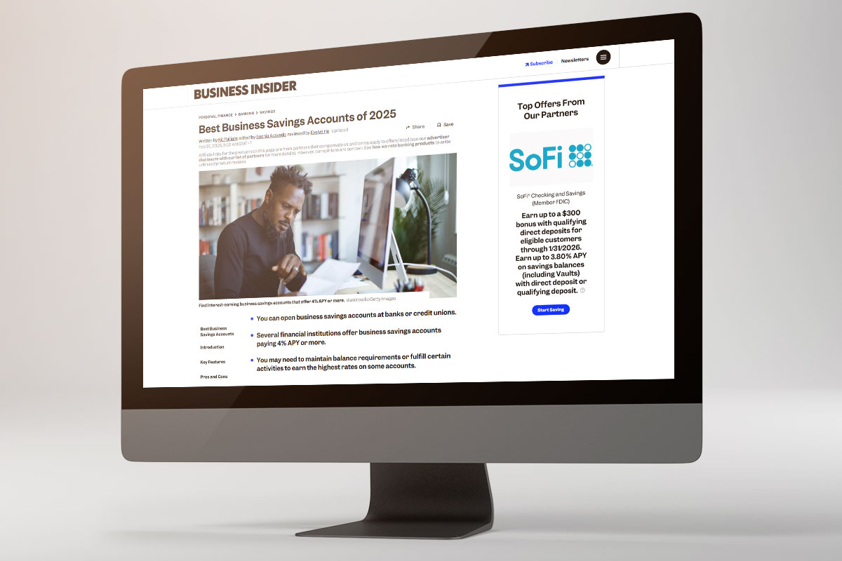 A computer monitor displaying a Business Insider article about the best business savings accounts.