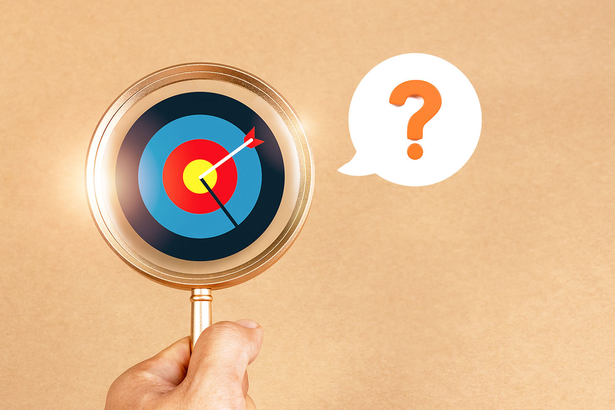 How to Start a Clothing Boutique (and Make $102K/Month) 5 A magnifying glass over a bullseye with a question mark hovering nearby.