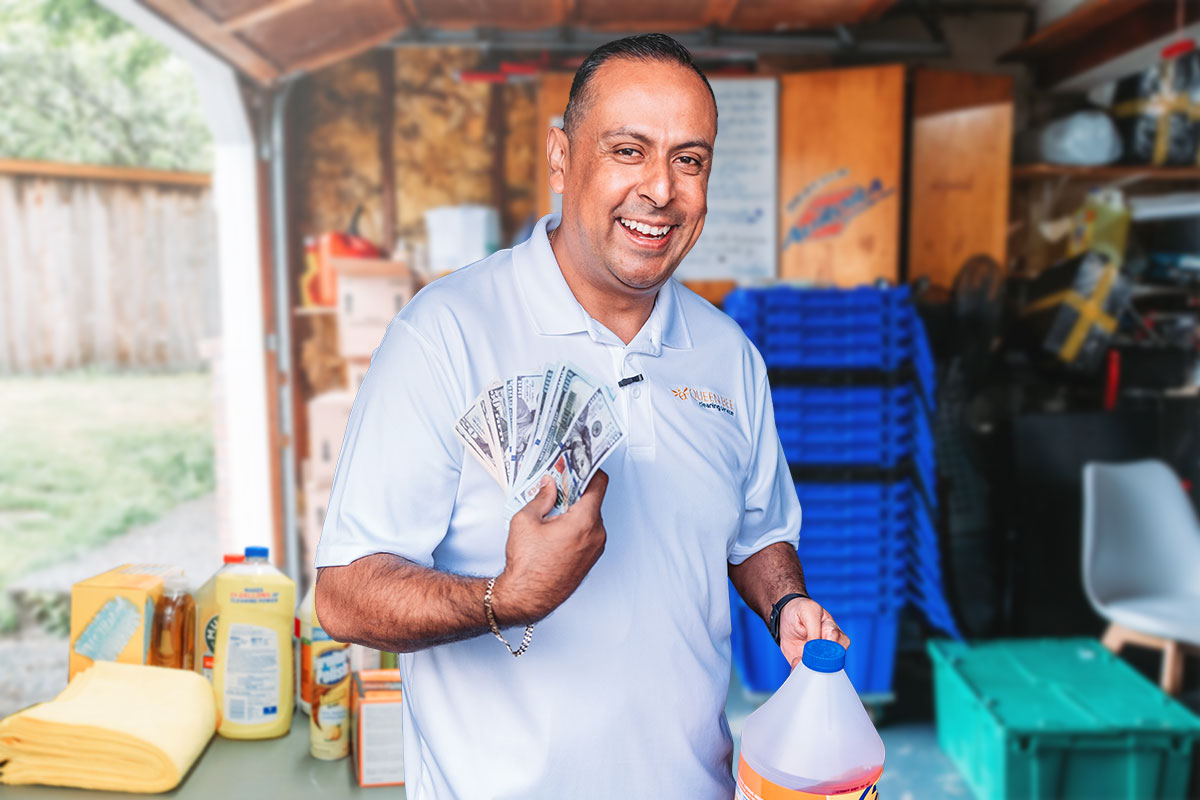 Small Business Marketing 21 Cris Mondragon holding a fan of cash and a jug of cleaning solution with other supplies and materials in the background.