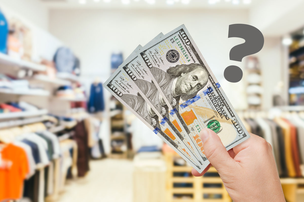 How to Start a Clothing Boutique (and Make $102K/Month) 2 A person holding a fan of cash inside a clothing boutique while a question mark hovers overhead.