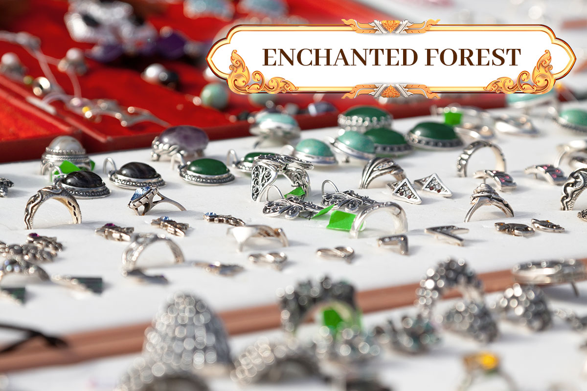 471 Best Jewelry Business Names 8 The business name Enchanted Forest hovering over a display case of silver jewelry.