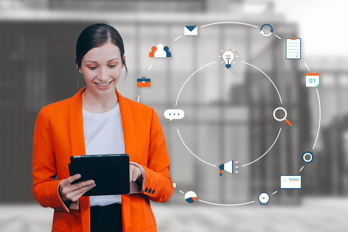 Small Business Marketing 1 A businesswoman working on a tablet while business-related symbols float in the air beside her.