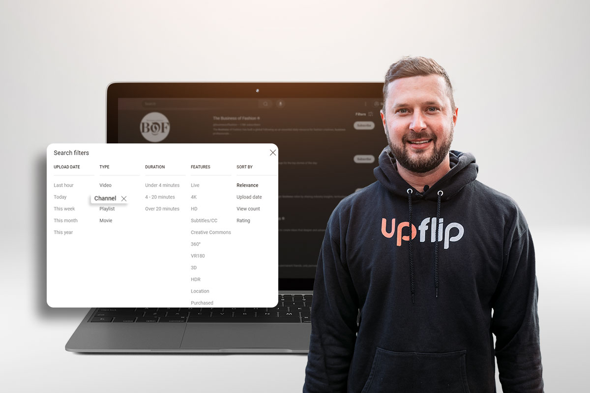 YouTube Automation 101 5 The UpFlip YouTube host standing in front of a laptop showing YouTube search filters.